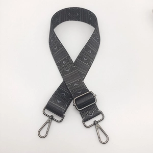 Close-up of geometric ethnic pattern woven strap with gunmetal swivel lobster clasps