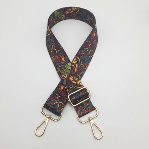 Ethnic print nylon wide shoulder strap with adjustable gold lobster clasps and buckles