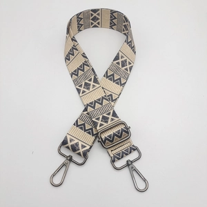 Close-up of ethnic geometric pattern nylon strap with adjustable metal buckles