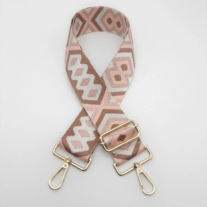 Detailed view of ethnic geometric pattern nylon strap with golden metal lobster clasps
