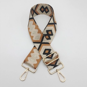 Detail showing vintage ethnic geometric weaving and gold metal swivel snap hooks