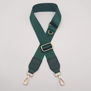 Deep green adjustable nylon shoulder strap with gold hardware and D-ring for bags
