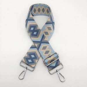 Adjustable wide canvas shoulder strap with geometric diamond weave and silver metal clips