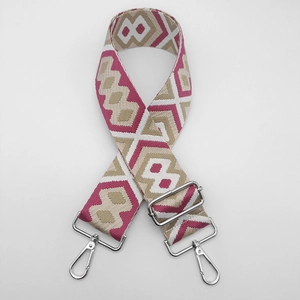 Close-up of diamond pattern jacquard woven bag strap with silver metal swivel hooks
