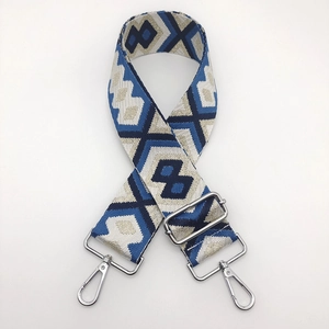 Close-up of geometric ethnic pattern nylon bag strap with silver metal lobster clasps