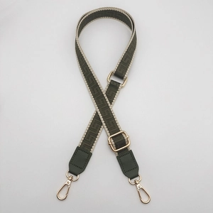 Adjustable dark green woven bag strap with geometric pattern and gold lobster clasps