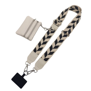 Detail of adjustable geometric strap with a beige coin purse and phone connector
