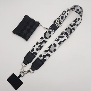 Detail of leopard print phone strap with silver carabiner and black zipper coin pouch