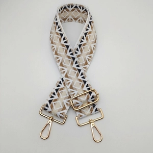 Detail of 5cm ethnic geometric woven strap with gold metal lobster clasps and buckles