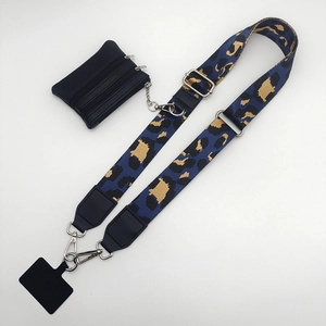 Adjustable leopard print strap with black coin purse and silver metal hardware details
