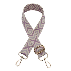 Adjustable woven shoulder strap with purple geometric diamond pattern and gold hardware
