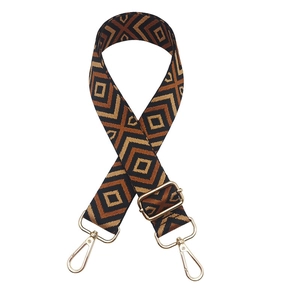 Close-up of ethnic geometric diamond pattern strap with gold metal lobster clasps