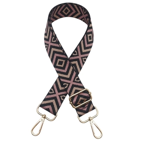 Close-up of adjustable woven shoulder strap with pink geometric lattice and gold buckles