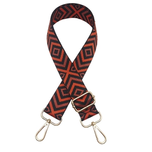 Close-up of red and black geometric rhombic woven strap with gold metal lobster clasps