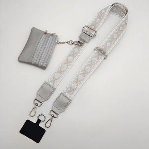 Close-up of adjustable crossbody strap with grey pouch and silver metal hardware