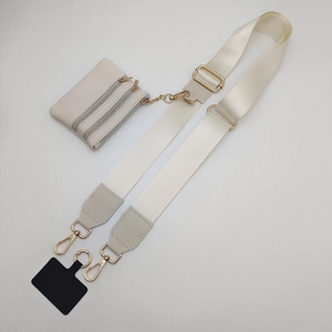 Cream wide nylon shoulder strap with adjustable gold buckle and small zipper coin pouch