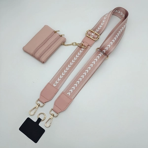 Pink jacquard phone crossbody strap with adjustable length and a matching coin purse