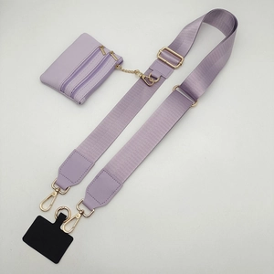 Detail view of lavender wide woven shoulder strap with matching zipper coin pouch and gold clips