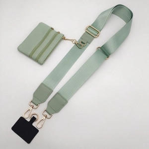 Detail of adjustable mint green nylon shoulder strap with matching small zipper pouch