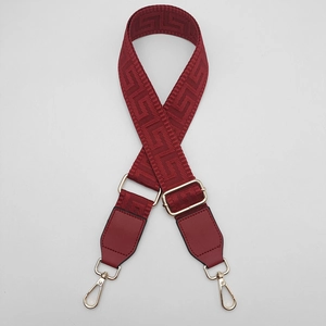 Deep red adjustable bag strap with Greek Key jacquard pattern and gold metal hooks