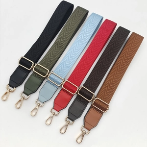 Detail of adjustable woven canvas bag straps in seven colors with gold metal hooks