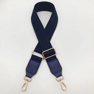 Adjustable dark blue herringbone canvas shoulder strap with gold metal hooks for handbags