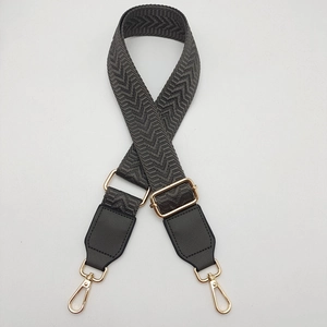 Adjustable gray herringbone canvas shoulder strap with gold metal buckles for crossbody bags
