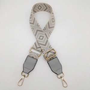 Adjustable geometric diamond pattern canvas shoulder strap with gold metal lobster clasps