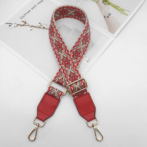 Ethnic geometric jacquard shoulder strap with red leather ends and gold metal clips