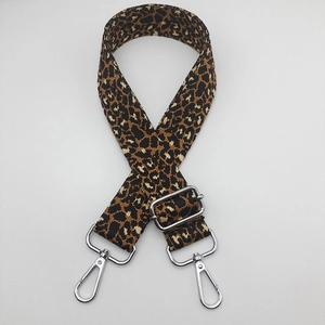 Close-up of adjustable leopard print bag strap with silver metal lobster clasps
