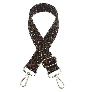 Adjustable leopard print wide shoulder strap with metal lobster clasps on white background