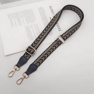 Adjustable wide woven shoulder strap with geometric pattern and gold swivel lobster clasps