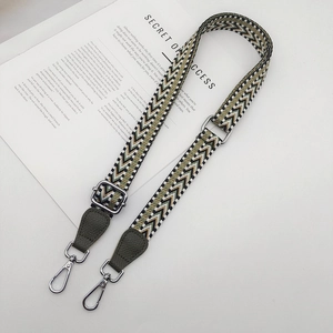 Adjustable woven shoulder strap with green leather ends and silver metal hooks