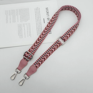 Adjustable woven shoulder strap with pink leather and geometric ethnic patterns
