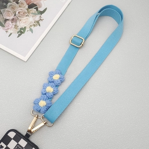 Light blue woven phone strap with yellow crochet flowers and checkerboard case
