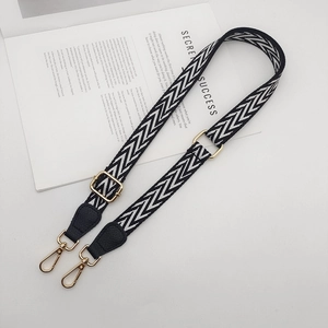 Adjustable wide replacement strap with black and white zigzag weave and gold buckles