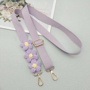 Adjustable purple woven shoulder strap with crochet daisy flowers and gold hardware