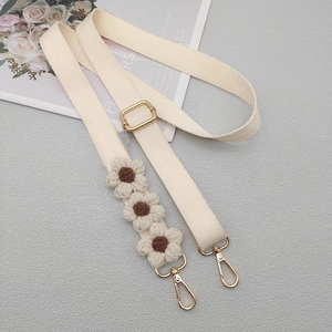 Adjustable beige canvas shoulder strap with handmade crochet daisy flowers and gold hardware