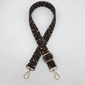 Detail of adjustable leopard print bag strap with golden metal swivel lobster clasps