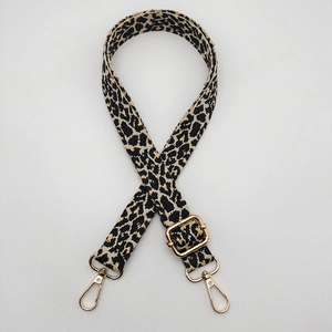 Adjustable leopard print bag strap with golden metal clasps for crossbody handbags
