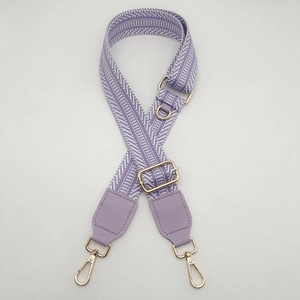 Adjustable canvas shoulder strap with purple chevron pattern and gold metal hooks