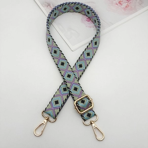 Detail of a 2.5cm geometric diamond woven strap with golden metal lobster clasps