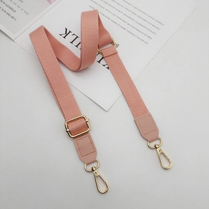 Pink woven replacement bag strap with golden swivel snap hooks and faux leather ends