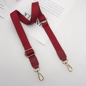 Adjustable red cotton shoulder strap with golden metal hooks and leather endings