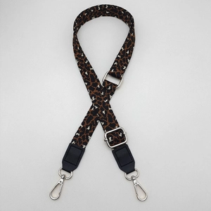 Detail of 2.5cm leopard print bag strap with silver metal hooks and black leather ends