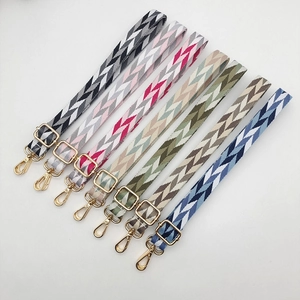Adjustable woven shoulder straps with geometric patterns and golden metal buckles