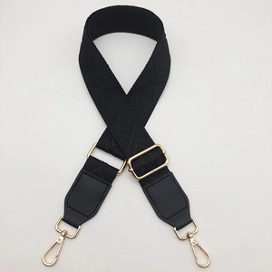 Adjustable black woven shoulder strap with geometric diamond pattern and gold metal hooks