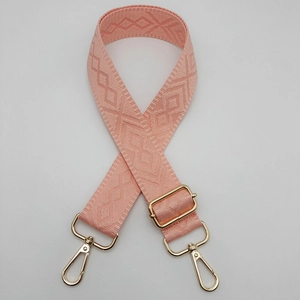 Pink adjustable shoulder strap with woven diamond pattern and gold metal buckles