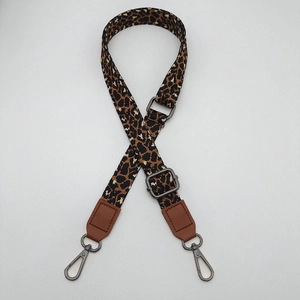 Adjustable leopard print bag strap with brown PU leather ends and metal lobster clasps