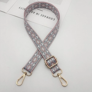 Adjustable wide shoulder strap with pink and grey geometric patterns and gold clips